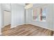 Dining room featuring a large window, modern lighting, and wood-look flooring at 17818 Se 120Th Ct, Summerfield, FL 34491