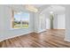 Bright entryway showcasing a decorative glass door, modern lighting, and an open floor plan at 17818 Se 120Th Ct, Summerfield, FL 34491