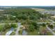 Aerial view of a residential area with lush greenery, mature trees and single-Gathering homes in a quiet suburban neighborhood at 1905 Nw 25Th Ave, Ocala, FL 34475