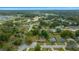 Aerial view of a residential area with single-Gathering homes, green lawns, and mature trees in a tranquil neighborhood setting at 1905 Nw 25Th Ave, Ocala, FL 34475