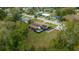 A cozy blue home with a well manicured lawn featuring solar panels, fenced backyard and a patio area at 1905 Nw 25Th Ave, Ocala, FL 34475