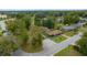 Aerial view of a single Gathering home with a large front yard and mature trees in a quiet residential neighborhood at 1905 Nw 25Th Ave, Ocala, FL 34475