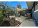 Inviting backyard patio area with shade sail, perfect for outdoor dining and relaxation at 1905 Nw 25Th Ave, Ocala, FL 34475