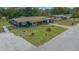 Charming single-story home featuring a landscaped front yard, inviting porch, and complementing blue and brown color scheme at 1905 Nw 25Th Ave, Ocala, FL 34475