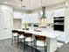 Modern kitchen featuring stainless steel appliances, a large island, and white cabinetry at 1955 Nw 79Th Loop, Ocala, FL 34475