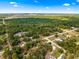 This aerial view shows the property's location, surrounded by lush greenery and neighboring homes at 20396 Sw 79Th Lane, Dunnellon, FL 34431