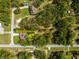 An aerial view shows the property's layout and its location on a quiet, tree-lined street at 20396 Sw 79Th Lane, Dunnellon, FL 34431