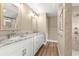 Bathroom featuring double sinks, granite countertops, and a tiled shower at 20396 Sw 79Th Lane, Dunnellon, FL 34431