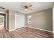 Bedroom featuring wood-look floors, a ceiling fan, and a closet at 20396 Sw 79Th Lane, Dunnellon, FL 34431