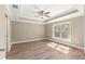 Spacious bedroom with large window, ceiling fan and tray ceiling at 20396 Sw 79Th Lane, Dunnellon, FL 34431