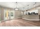 Dining room with modern lighting, an open-concept design, and access to the backyard at 20396 Sw 79Th Lane, Dunnellon, FL 34431