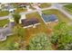 Aerial view of a neighborhood showcasing a home with a well-maintained yard at 21 Pecan Pass Ter, Ocala, FL 34472