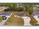 An aerial view showcases the home's position on a quiet street with a large driveway at 21 Pecan Pass Ter, Ocala, FL 34472