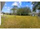 A spacious backyard with mature trees providing ample shade at 21 Pecan Pass Ter, Ocala, FL 34472