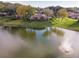 Aerial view of a lake with a fountain and a recreation center at 2418 Se 17Th Cir, Ocala, FL 34471