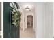 Welcoming entryway featuring tile flooring, interior door, coat closet, and a glimpse into the home at 2418 Se 17Th Cir, Ocala, FL 34471