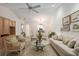 Open-concept living room with high ceilings, tile flooring, and a view of the dining area at 2418 Se 17Th Cir, Ocala, FL 34471