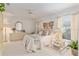 The main bedroom features neutral tones, a ceiling fan, and ample natural light at 2418 Se 17Th Cir, Ocala, FL 34471