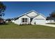 Beautiful single-story home featuring a manicured lawn and a two-car garage at 243 Marion Oaks Trl, Ocala, FL 34473