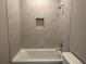 Modern bathroom with tiled shower over tub, and neutral paint at 2728 Sw 154Th Place Rd, Ocala, FL 34473