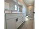 Bathroom featuring double vanity, modern fixtures, and glass-enclosed shower at 2728 Sw 154Th Place Rd, Ocala, FL 34473
