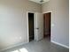 Bedroom with walk-in closet showing ample storage space and neutral paint colors at 2728 Sw 154Th Place Rd, Ocala, FL 34473