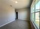 Bedroom showcasing light-colored walls, a window and closet in a clean layout at 2728 Sw 154Th Place Rd, Ocala, FL 34473