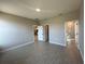 Open bedroom showcasing wood-look tile flooring, ensuite bathroom and walk-in closet access at 2728 Sw 154Th Place Rd, Ocala, FL 34473