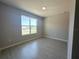 Bedroom featuring a large window, allowing ample natural light into the space at 2728 Sw 154Th Place Rd, Ocala, FL 34473