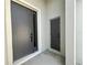 Modern gray front doors and entry provide security and visual appeal at 2728 Sw 154Th Place Rd, Ocala, FL 34473