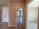 View of open hallway featuring wood-style floors leading to bright rooms at 2728 Sw 154Th Place Rd, Ocala, FL 34473
