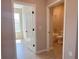 Hallway view showcasing the doorway to a bathroom with a tub and the doorway to a bedroom at 2728 Sw 154Th Place Rd, Ocala, FL 34473