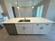Bright kitchen island features a stainless steel dishwasher and modern fixtures at 2728 Sw 154Th Place Rd, Ocala, FL 34473