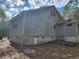 Back exterior of the house with visible water stains and some yard at 3081 Ne 49Th St, Ocala, FL 34479