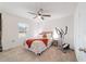 Cozy bedroom with carpet flooring, a ceiling fan and a window that lets in natural light at 3125 Sw 172Nd Lane Rd, Ocala, FL 34473