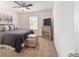 Bedroom with carpet flooring, a gray color palette and a large TV on a dresser at 3125 Sw 172Nd Lane Rd, Ocala, FL 34473