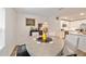 Bright dining area with gray table and chairs and a bar area at 3125 Sw 172Nd Lane Rd, Ocala, FL 34473