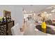 Dining area with table and chairs flowing into a modern white kitchen at 3125 Sw 172Nd Lane Rd, Ocala, FL 34473