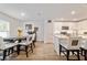 Dining room featuring modern table and chairs with decorative backs and view into kitchen at 3125 Sw 172Nd Lane Rd, Ocala, FL 34473