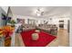 Spacious living room featuring comfortable seating, a ceiling fan, and an open layout connecting to the kitchen at 3125 Sw 172Nd Lane Rd, Ocala, FL 34473