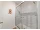 Tiled shower with a glass enclosure and a marble look throughout at 3125 Sw 172Nd Lane Rd, Ocala, FL 34473