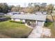 Aerial view of the home and front yard showing the garden, front yard, and attached garage at 3204 Ne 16Th Ave, Ocala, FL 34479