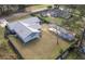 Aerial view of the house showing the back yard with gray roof, shed, and fenced yard at 3204 Ne 16Th Ave, Ocala, FL 34479