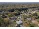 An elevated view showcases a peaceful neighborhood with homes nestled among mature trees and landscaping at 3204 Ne 16Th Ave, Ocala, FL 34479