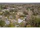 Bird's eye view of a residential neighborhood with tree coverage and property in the foreground at 3204 Ne 16Th Ave, Ocala, FL 34479