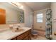 Bathroom featuring a single sink vanity and shower/tub combo at 3204 Ne 16Th Ave, Ocala, FL 34479