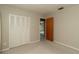 This bedroom boasts closet space, carpet flooring and a ceiling fan at 3204 Ne 16Th Ave, Ocala, FL 34479