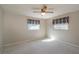 Bright bedroom with neutral walls and plush carpet, enhanced by natural light from two windows at 3204 Ne 16Th Ave, Ocala, FL 34479