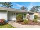 Charming single-story home entrance featuring well-maintained landscaping and an ADT security sign at 3204 Ne 16Th Ave, Ocala, FL 34479