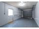 A spacious garage with plenty of shelving and a door to outside at 3204 Ne 16Th Ave, Ocala, FL 34479